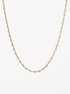 Complete your jewelry collection with this contemporary and adjustable link chain necklace dipped in 14k gold. This essential link chain necklace is perfect for layering or wearing alone as a delicate statement piece. This link chain necklace is also available in a bold design. Classy chain necklace dipped in 14k gold   Essential jewelry piece with a contemporary design   Adjustable size that works with any neckline Unlike Jennifer Fisher, Alexander Wang, david Yurman, Net-a-porter, Missoma, Ros Modern Yellow Gold Cable Chain Necklace, Modern Jewelry With Delicate Link Chain, Minimalist Yellow Gold Chain Necklace With Adjustable Chain, Modern 14k Gold Chain Necklace, Modern Yellow Gold Delicate Chain Necklace, Minimalist Oval Link Necklace With Adjustable Chain, Modern Necklace With Delicate Chain And Rectangular Links, Modern 14k Gold Necklace With Cable Chain, Minimalist Yellow Gold Oval Link Chain Necklace