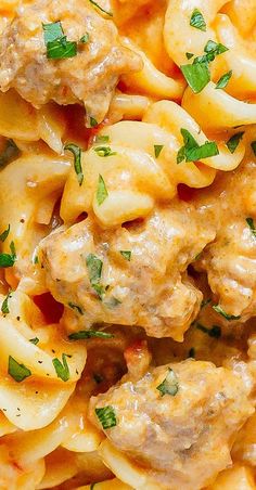 pasta with meat and sauce in a white bowl