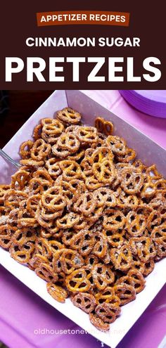 a plate full of pretzels sitting on top of a purple table cloth with the title, appetizer recipes cinnamon sugar pretzels