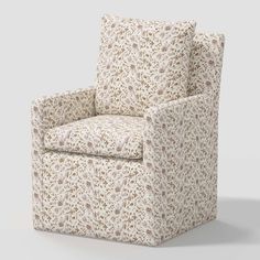 an upholstered chair with a floral pattern on the armrests and back