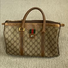 Authentic Gucci Vintage Gg Logo Web Boston Bag Item Condition: From A Well Loved Home. Handles And Other Areas Of Handbag Are Pretty Worn And Inner Pocket Has A Stain. Please See Photos! If You Would Like Additional Photos, Please Request In Comments. Approximate Dimensions: Height: 6.2", Length: 10.6", Depth: 5.1", Drop: 4.3" Made In Italy Code: 40.02.007 Gucci Brown Satchel Bag, Vintage Gucci Tote Shoulder Bag, Vintage Gucci Rectangular Bag, Vintage Gucci Top Handle Bag, Gucci Rectangular Satchel With Branded Hardware, Gucci Brown Satchel For Daily Use, Gucci Brown Tote Satchel, Classic Brown Gucci Satchel, Classic Brown Gucci Bag