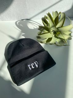 ‘Rep’ machine embroidered in white on a charcoal black knit beanie. Measures 12 inches tall with a 3 inch adjustable cuff. Black Embroidered Beanie Cap, Black Embroidered Beanie One Size, Black Embroidered Beanie, One Size Fits Most, Black Embroidered Beanie For Winter, Black Embroidered Beanie Hat, Black Embroidered Beanie, Housewarming Greetings, Reputation Taylor Swift, Michigan Sticker