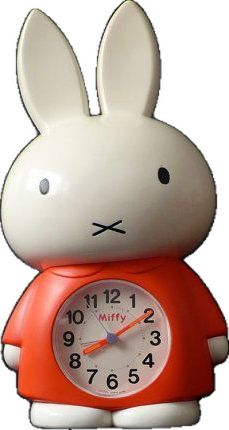 a clock shaped like a rabbit with an orange shirt on it's chest and ears