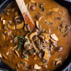 mushroom soup in a pot with a wooden spoon