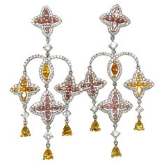 Chandelier earrings with three rows of fancy color diamonds in a arabesque motif, connected with a pavé of round brilliant white diamonds. Set in 18-karat gold. Approximately 2.25″ long. Fancy color diamond weight: 3.21 total carats. White diamond weight: 1.64 total carats. Motif Arabesque, Gold For Sale, Diamond Gold, Women Diamond, Opal Earrings, Fancy Color Diamonds, Yellow Diamond, Pink Diamond, Arabesque