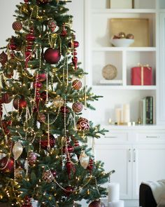 a christmas tree with red and gold ornaments