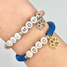 This listing is for ONE Dog Name Bracelet in gold or silver. Makes a great gift for any pet lover!  Over 50 heishi bead colors to choose from! Product Details: *These bracelets have a snug fit. The average woman's wrist is 6.75". Please measure your   wrist before ordering. I would add .5" to your size if you would like a looser fit. *Use the personalize box at checkout to enter name/word /phrase AND style of letter bead.  *All letters are upper case.  *Bracelets are made from high quality jewel Dog Mom Bracelet Stack, Dog Mom Bracelet, Bracelet Images, Dog Charm Bracelet, Dog Bracelet, Pet Jewelry, Animal Bracelet, Multiple Bracelets