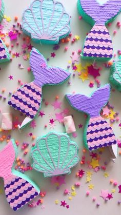 some little mermaid cookies that are on a table