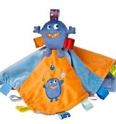 a blue and orange stuffed animal with teeth