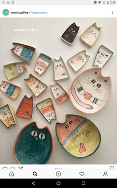 a group of ceramic bowls with cats on them