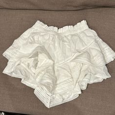 Super Cute For A Coastal Trip, Or Like A Dinner Night Out After The Beach! It Is Super Cute But I Outgrew It, It Fits Xs-S/M It Is Stretchy And Comfy White Skirted Shorts With Ruffles, White Ruffled Short Mini Skirt, White Mini Skirt For Summer Daywear, Bohemian Shorts With Ruffles, White Ruffled Skirt Shorts For Day Out, Ruffled Skort For Vacation, White Tiered Skirt Summer Bottoms, Short Ruffled Skort For Vacation, White Tiered Skirt For Summer