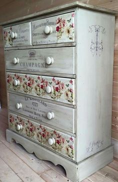 an old dresser with flowers painted on it