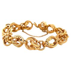 Integrated double links of bright and satin eighteen karat 18K yellow gold reflect plenty of light and create interest on this timeless eight inch chain link style bracelet. With a moderate overall width measurement of approximately 11.5mm, this stylish piece makes a great statement worn on it's own or stacked along with other eclectic items in your jewelry wardrobe. Has a spring ring closure and safety chain. Gift Boxed. Luxury Link Chain Bracelet Fine Jewelry, Luxury Double Strand Jewelry With Adjustable Chain, Luxury Yellow Gold Chain Bracelet With Toggle Clasp, Luxury Vintage Jewelry With Double Chain, Luxury Yellow Gold Jewelry With Hooks And Links, 1950s Bracelet, Textured Bracelet, Jewelry Wardrobe, Gold Link Bracelet