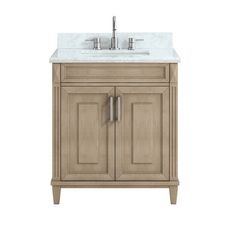 a bathroom vanity with a marble top and two doors on one side, the sink is shown