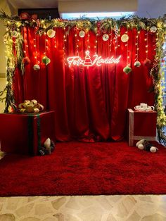 a red carpeted room with christmas decorations and lights