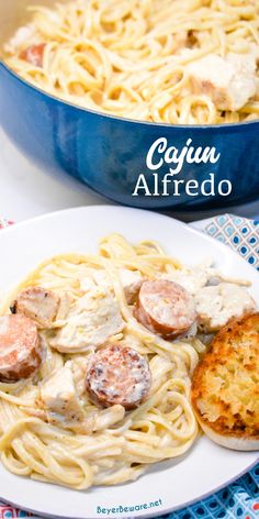 the pasta dish is ready to be eaten with chicken and mushrooms on top, along with some bread