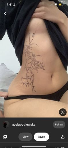 a woman with a tattoo on her stomach