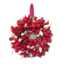 a wreath with red and white flowers on it