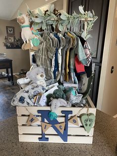 a wooden crate filled with lots of baby items