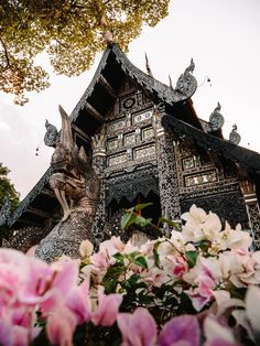 a building with flowers in front of it