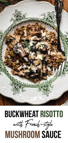 a white plate topped with mushrooms and other food on top of a wooden table next to a fork