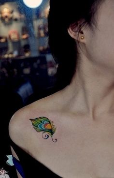 a woman with a tattoo on her shoulder