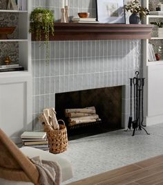 a living room filled with furniture and a fire place in front of a book shelf