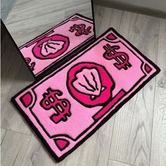 two pink rugs on the floor in front of a mirror with chinese writing and symbols