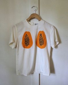 Fitted Graphic Tee With Print, Fitted Printed Graphic Tee Shirt, Fitted Printed Graphic Tee, Fitted Graphic Tee Shirt, Casual Orange Blouse With Graphic Print, Fitted Top With Funny Print For Summer, Fitted Shirt With Funny Print For Summer, Orange Graphic Print Top With Relaxed Fit, Fitted Summer Tops With Funny Print