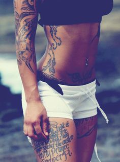 a woman with tattoos on her stomach and arms is shown in an instagramture