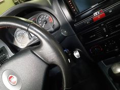 the steering wheel and dashboard of a car