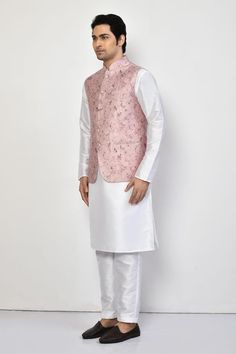 Pink silk bundi with all over monotone floret print and patch pockets. Paired with white full sleeves kurta and straight pant. - Aza Fashions White Sleeveless Nehru Jacket For Festive Occasions, Sleeveless White Nehru Jacket For Festive Occasions, Festive White Sleeveless Nehru Jacket, Sleeveless White Nehru Jacket For Wedding, White Sleeveless Nehru Jacket For Spring, Fashion App, Pink Silk, Straight Pants, Full Sleeve