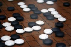 a board game with black and white pieces on it