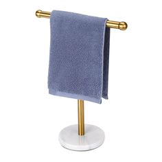 a blue towel is hanging on a gold - plated stand