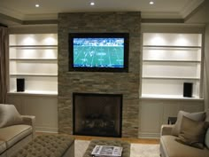 a living room filled with furniture and a flat screen tv mounted on the wall above a fireplace