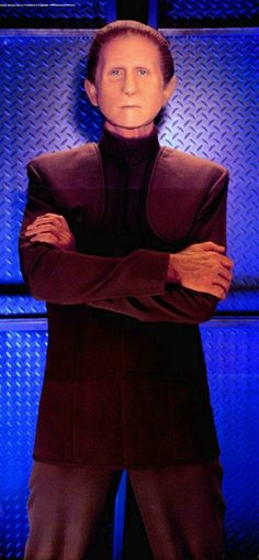 a star wars character with his arms crossed in front of a blue wall and floor