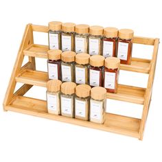 several jars of honey sit on a wooden shelf