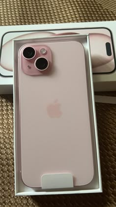 an iphone case in its box with the camera attached to it's back side