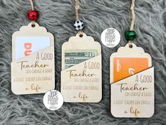 three wooden teacher gift tags on a fur surface