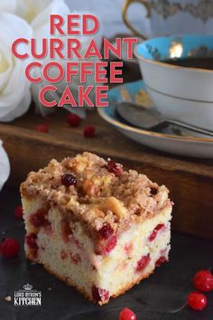 a piece of cranberry coffee cake sitting on top of a wooden cutting board