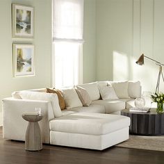 a living room filled with furniture and a large window