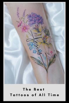 the best tattoos of all time are on this woman's arm and leg, with flowers