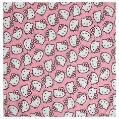 a pink hello kitty print fabric with white and black cats on the back of it