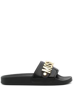 black slip-on style single toe strap gold-tone logo lettering open toe moulded footbed branded insole rubber sole Moschino Logo, Chanel 2, Iconic Bags, Demi Fine Jewelry, Summer Beach Wear, Flat Boots, Fine Earrings, Black Slip Ons, Ballet Flat Shoes