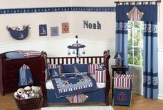 a baby crib bedding set with an anchor theme