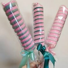 pink and green candy sticks wrapped in cellophane