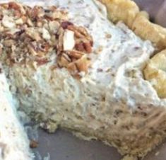 there is a large piece of cake with nuts on it