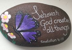 a painted rock with the words, jehovahn god created all things written on it