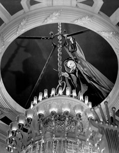 an old black and white photo of a chandelier