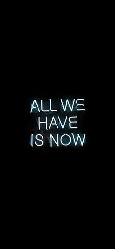 the words all we have is now are lit up in the dark with neon lights